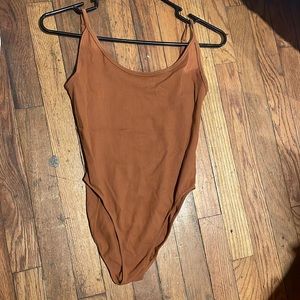 Open back maroon body suit